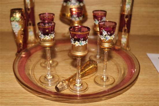 A Venetian ruby and gilt-painted liqueur set with a pair of matching vases and tray